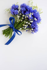 postcard mockup. a bouquet of blue cornflowers and space for text. invitation. congratulation