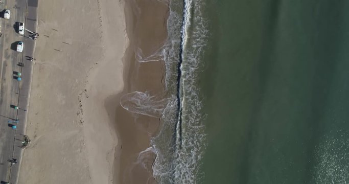 Bournemouth beach birds eye view pan up to reveal long coast line