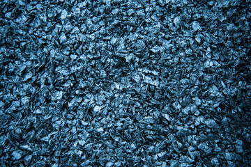 Particles of crushed plastic are black in color. Plastic before melting. Reuse. The concept of caring for the environment.