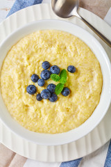 Creamy hot millet breakfast porridge, top view