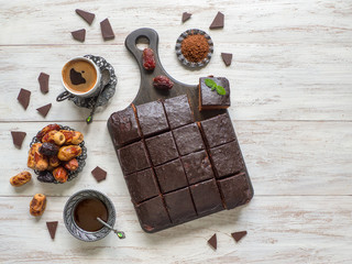 Chocolate brownie cake, dessert on white wooden background