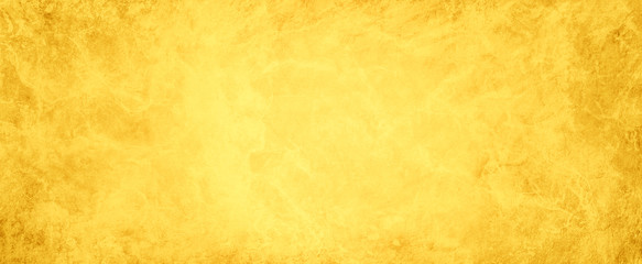 gold background paper with marbled texture and old vintage grunge, elegant yellow faded painted metal abstract pattern design