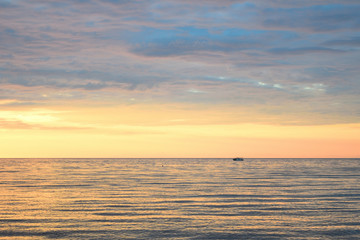 Obraz premium Cloudy sunset over the sea at Therma beach – Samothraki island, Greece, Aegean sea