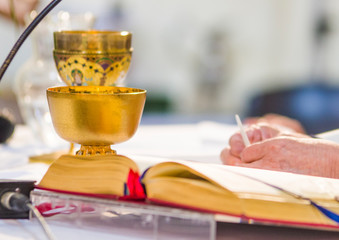 altar with host and chalice with wine in the churches of the pope of rome, francesco