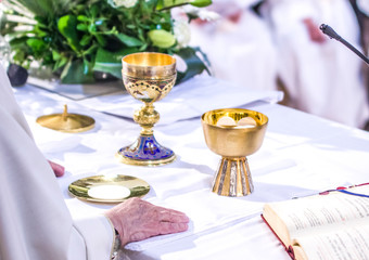 altar with host and chalice with wine in the churches of the pope of rome, francesco