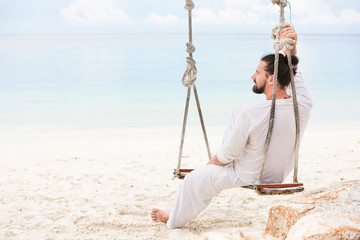 Businessman freelance on beach dreaming. Sand beach