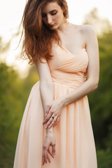 Fine Art Portrait of a beautiful bride in a summer garden