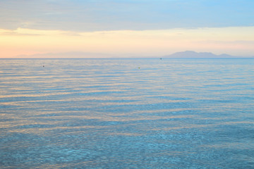Naklejka na ściany i meble Cloudy sunset over the sea at Therma beach – Samothraki, Greece
