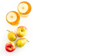 Fruit drinks with apple and pear on white table top-down copy space