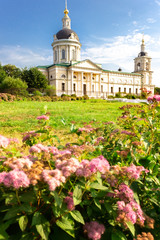 Kolomna, Moscow region, Russia -23/06/2019 - Church of the Archangel Michael in the spring among the flowers and rays of the sun.