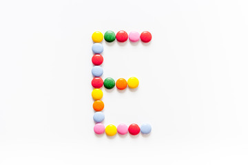 Candies font alphabet. Letter E isolated top view