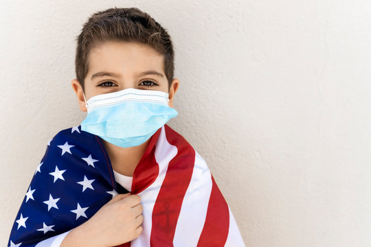 Little Child With American Flag And Face Mask