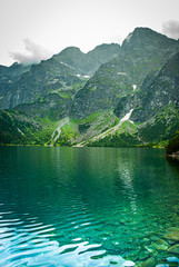Naklejka na ściany i meble Mountain lake in the mountains - Tatra eye of the sea