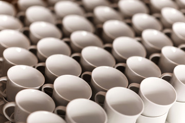 Group of empty white coffee cups.Many rows of white cup for service tea or coffee in breakfast or buffet and seminar event.