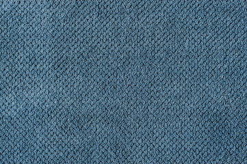 The texture of the fabric is plush blue. Abstract texture.