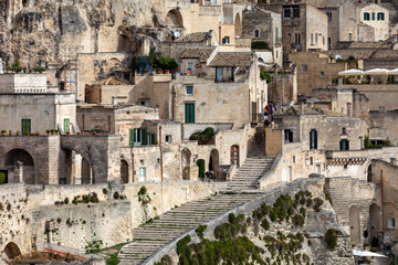 Fototapeta na wymiar Matera, Italy - September 20, 2019: View of the Sassi di Matera a historic district in the city of Matera, well-known for their ancient cave dwellings. Basilicata. Italy