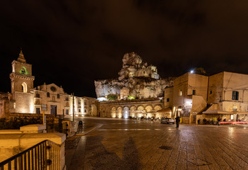 Fototapeta na wymiar Night view at Church of San Pietro caveoso and on the top of the hill of Church of Saint Mary of Idris in Matera, Basilicata, Italy