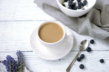 Breakfast with coffee, blueberries and soft cheese or cottage cheese