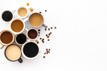 Many cups of coffee on white desk top view space for text
