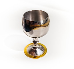 Metallic glass shot glass close up isolated on a white background