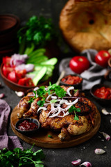 Fototapeta na wymiar Chicken Tabaka.traditional Georgian dish .selective focus
