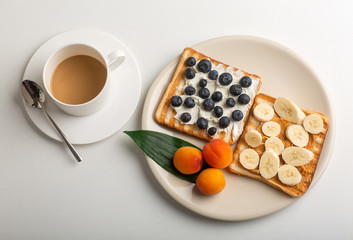 Breakfast is served with coffee, juice, cereals and fruit. Balanced diet. Healthy Breakfast-yogurt with muesli and berries-the concept of health and diet. A Cup of oatmeal granola with fresh blueberry