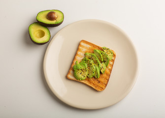 Healthy diet. Sandwich with sliced avocado, salt and pepper, on toasted bread for a healthy Breakfast or snack, copy the space.Food ration.