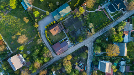 Top view of the village with private houses at sunset. Aerial view.