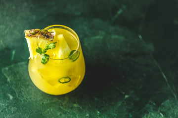 Spicy pineapple jalapeno mezcalita or margarita for Cinco de Mayo is a refreshing cocktail made...