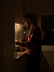 Cooking dinner at home in the evening