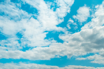 Fototapeta premium Blue sky background with soft clouds. Weather forecast concept.