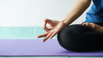 woman in meditating yoga instructor. sitting on lotus pose at home. Yoga concept.healthy lifestyle concept.