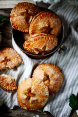 Jam filled hand pies. .Dark rustic photo