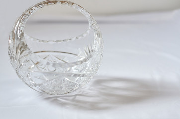 crystal vase and beautiful fabric on the surface