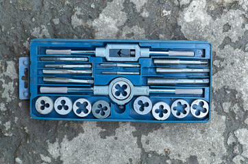 set of dies for threading isolated on grey background