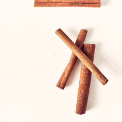 cinnamon sticks pattern on a white background, top view