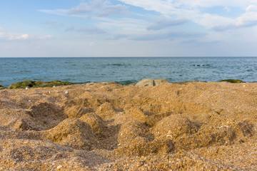 Sand castle standing on the beach. Travel vacations concept.