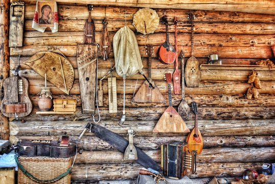 Old Musical Instruments On Wooden Wall