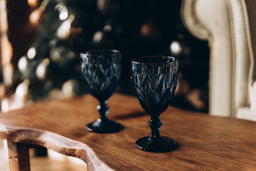 blue glasses against the background of a New Year's garland