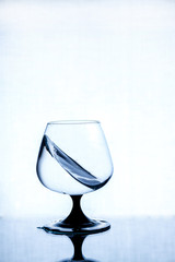 Splashes of water in a glass glass