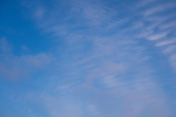Beautiful pen cloud stripes on a blue sky. Light background and texture