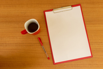 Office desk, note paper and accessories on the wooden table background, viewed from above