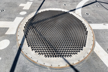 Mesh anchoring system on flight deck to receive medium helicopters in Maritime action warship.