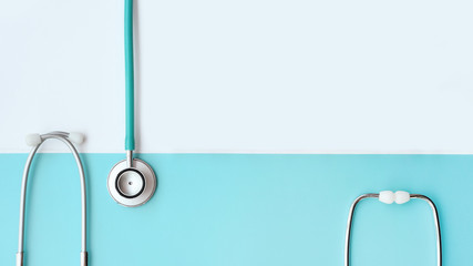 close up of stethoscope on white and blue background     