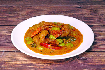 Stir fried shrimp in red curry with bitter beans, one of most famous Thai food in Southern Thailand. Selective focus.