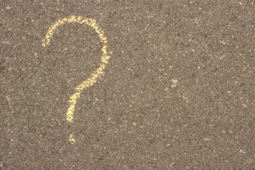 Fototapeta na wymiar question mark in chalk on the pavement. Copy space for your text