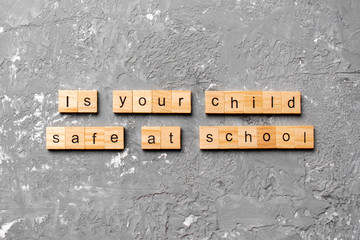 Is your child safe at school word written on wood block. Is your child safe at school text on...