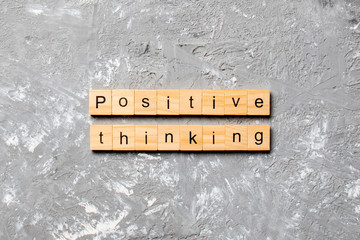 positive thinking word written on wood block. positive thinking text on table, concept