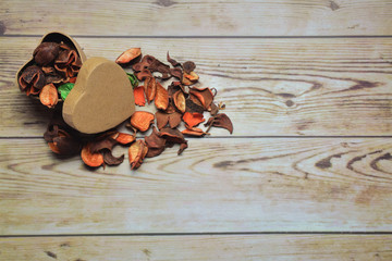 Paper heart, outline with dry leaves, space for text