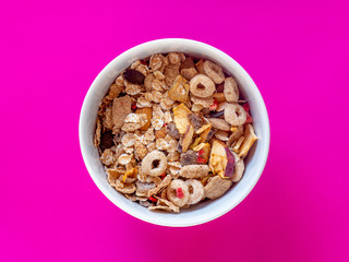 A bowl of muesli and fruits